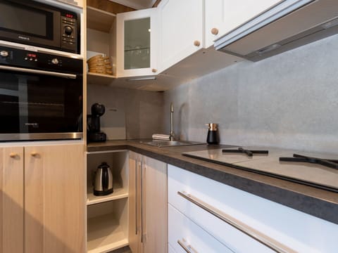 Kitchen, Kitchen Appliance, Countertop, Cabinetry, Major Appliance, Interior Design, Home Appliance, Wood, Kitchen Stove, Furniture