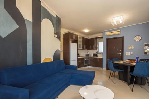 Apartment, City View | Living area | 50-inch Smart TV with cable channels