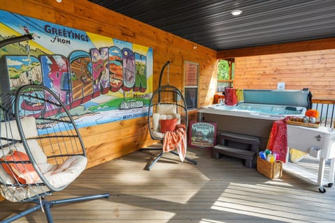 Covered and screened deck as wide as the house with private hot tub!