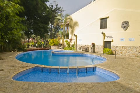 Outdoor pool, open 7:00 AM to 9:00 PM, pool umbrellas, sun loungers