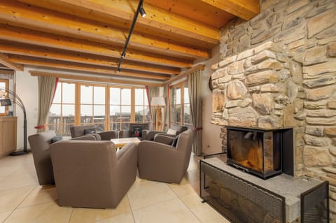 Panoramic Chalet, 4 Bedrooms, Sauna (Incl. 407 EUR cleaning fee) | Living area | LCD TV, fireplace