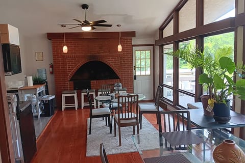 Seating for 12 people in chairs and bench seating.