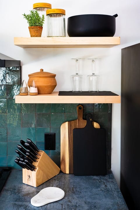 Charming kitchen details with natural wood accents, open shelving, and essentials for easy meal prep.