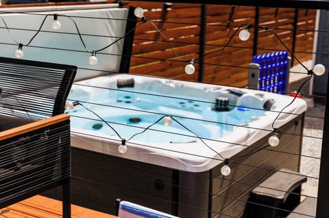 Private hot tub vibes — bubbles, twinkling lights, and pure relaxation await!
