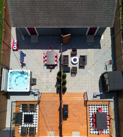 Soak in the private hot tub, gather around the firepit, relax in the sauna or dine and play games under the open sky, this fully fenced backyard retreat is perfect for making memories just minutes from Downtown Indianapolis!