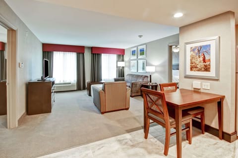 Suite, 2 Bedrooms, Non Smoking | Living area | 32-inch TV with cable channels, MP3 dock