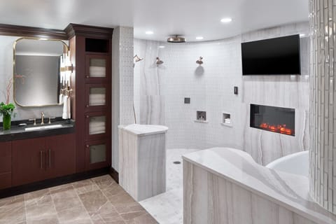 Separate tub and shower, designer toiletries, hair dryer, towels