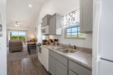 The open, airy kitchen offers ample space & every home comfort
