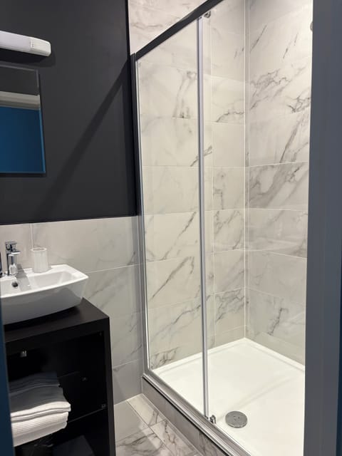 Shower, towels, soap, toilet paper