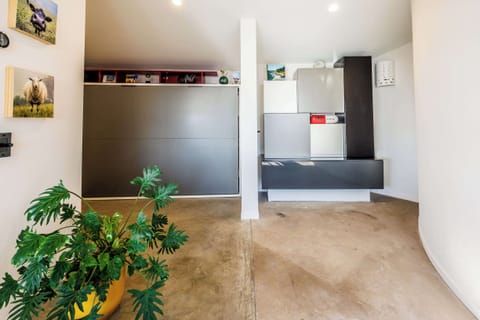 A Queen Size Murphy Bed is tucked away for guests on the second floor