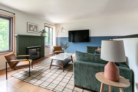 Bright and welcoming space with cozy seating and a Roku TV. Perfect for relaxing or streaming your favorite shows.