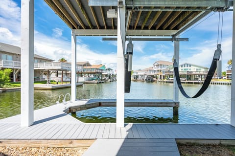 Your waterfront playground — dock, swim ladder, and canal views.