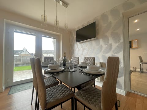 The dining space is perfect for family, friends, and guests.