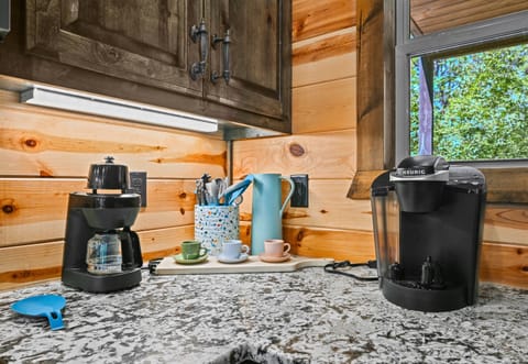 Your coffee bar awaits, featuring both drip and pod options—perfect for early risers and lazy mornings alike.