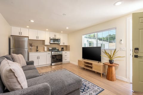 Relax in our stylish lounge with kitchenette and smart TV.