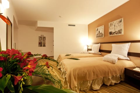 Standard Double or Twin Room | Minibar, in-room safe, individually decorated, desk