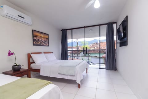 Deluxe Triple Room, Balcony, City View | Free WiFi