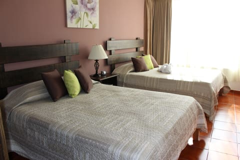 Standard Double Room, 2 Queen Beds, City View | Down comforters, minibar, in-room safe, blackout drapes