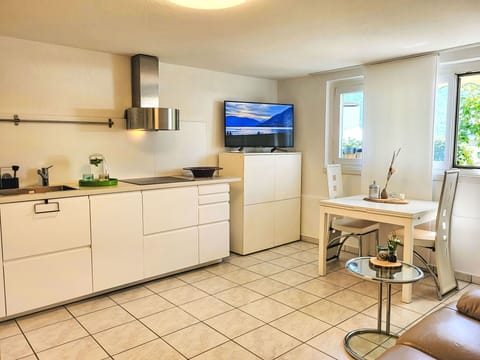 Furniture, Interior Design, Kitchen, Countertop, Flooring, Cabinetry, Kitchen Appliance, Floor, Room, Ceiling