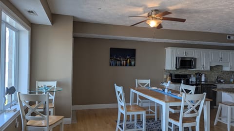 Total dining seats 8:  4- kitchen table, 2 - side table (shown) and 2- counter.