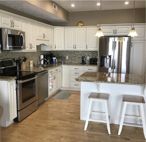 Open concept stainless steel kitchen. 
