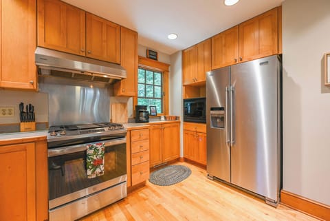 Kitchen with drip-style coffee maker, dishwasher, and gas range