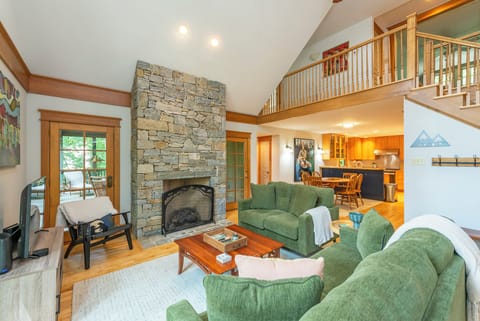 Living room with gas log fireplace and 42" TV for streaming