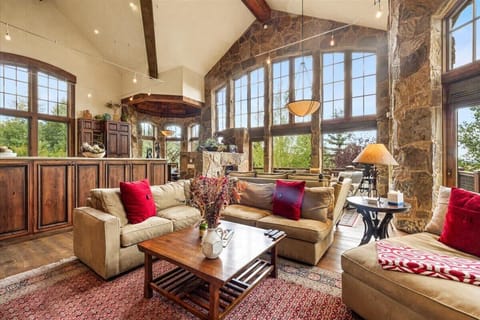 Living room 1: Gas fireplace, Smart TV, balcony access, main floor