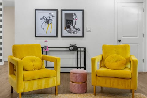 A cozy living room with large smart TV- the fireplace is not operational