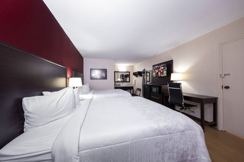 Deluxe Room, 2 Queen Beds (Smoke Free) | Desk, laptop workspace, blackout drapes, iron/ironing board