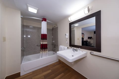 Deluxe Room, 1 King Bed, Accessible (Smoke Free) | Bathroom | Combined shower/tub, hair dryer, towels, soap