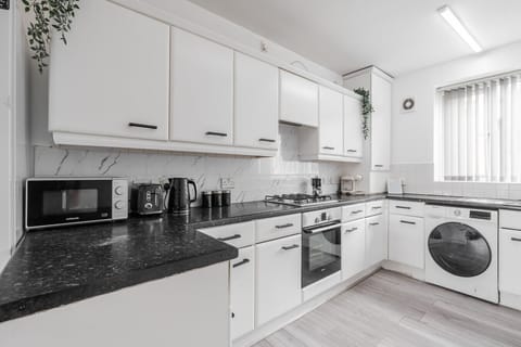 Kitchen. Fully equipped with cooking equipment perfect for families. Appliances such as fridge freezer, microwave, cooker, oven, dishwasher Toaster are free and available for your use.