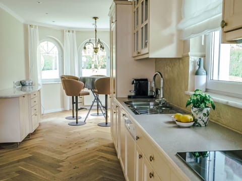 Furniture, Interior Design, Countertop, Flooring, Cabinetry, Kitchen, Floor, Wood, Kitchen Appliance, Home