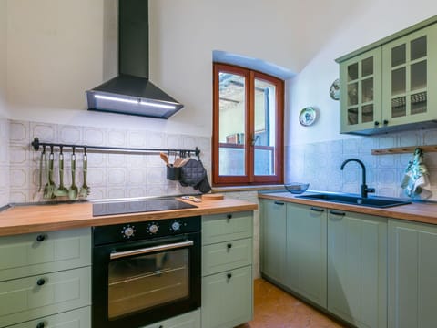 Flooring, Interior Design, Wood, Floor, Kitchen, Room, Furniture, Lighting, Cabinetry, Countertop