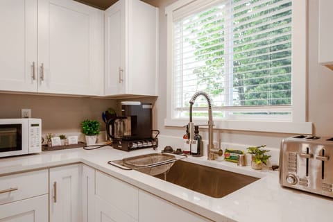 Open space with sleek countertops and modern appliances. Perfect for whipping up meals