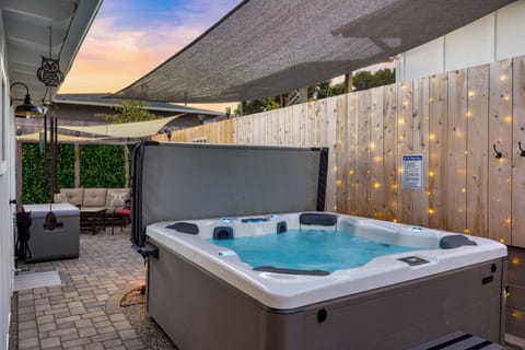 Private hot tub with sun shade.
