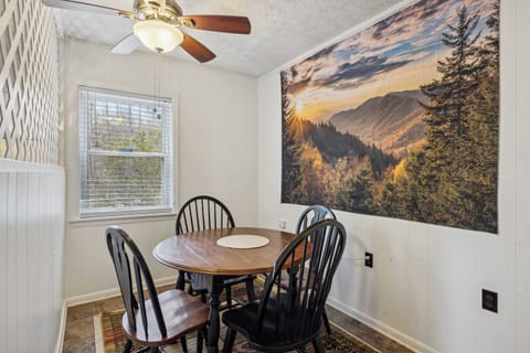 Dining/game table with seating for 4 in unit B's bedroom 1