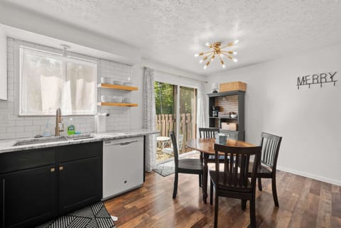 The sleek eat-in kitchen offers ample space & all the comforts of home