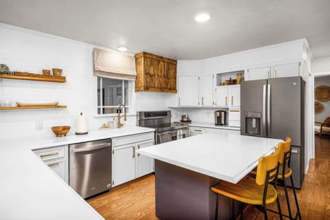 Bright kitchen with central island for cooking or casual dining.