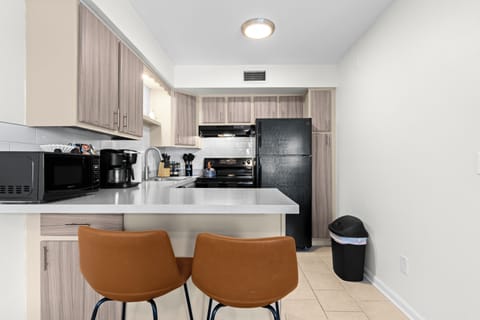 Ample counter space and a breakfast bar for casual dining.