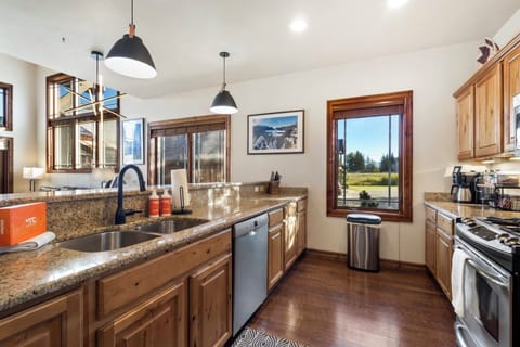 Our galley kitchen with granite countertops is perfect for gatherings.