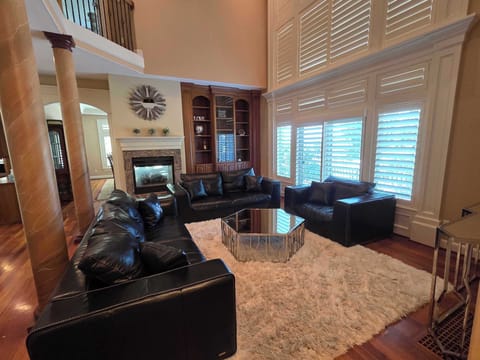 Formal dining room seating eight beneath a crystal chandelier