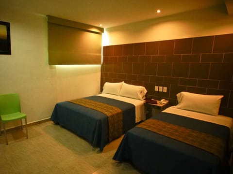 Family room with 1 king bed and a single bed | Premium bedding, in-room safe, iron/ironing board, free WiFi