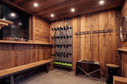 The dedicated ski room offers convenience and style, with ample storage for gear and benches for easy preparation before hitting the slopes.