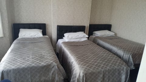 Triple Room | Desk, soundproofing, iron/ironing board, free cribs/infant beds