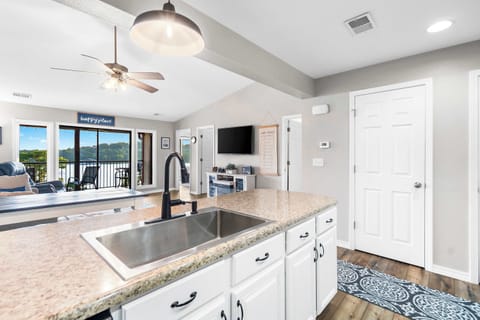 The open kitchen offers ample space & every home comfort