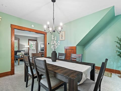 Stylish dining room with seating for six, open to kitchen—great for shared meals 🍴🌿✨