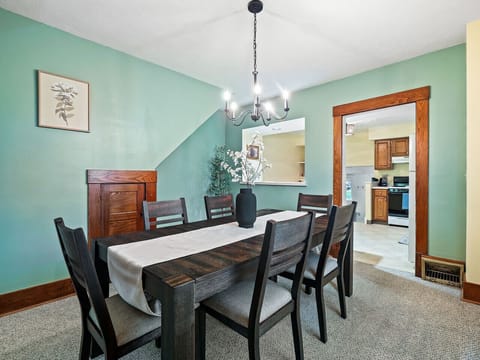 Stylish dining room with seating for six, open to kitchen—great for shared meals 🍴🌿✨
