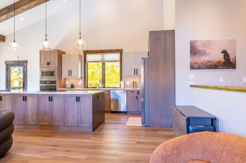 View into kitchen (extra flip-top table on right--seats 4 more)