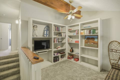 Quaint lofted space as you head upstairs. There are 2 bedrooms and one full bath on this level. This home sleeps 8 guests.